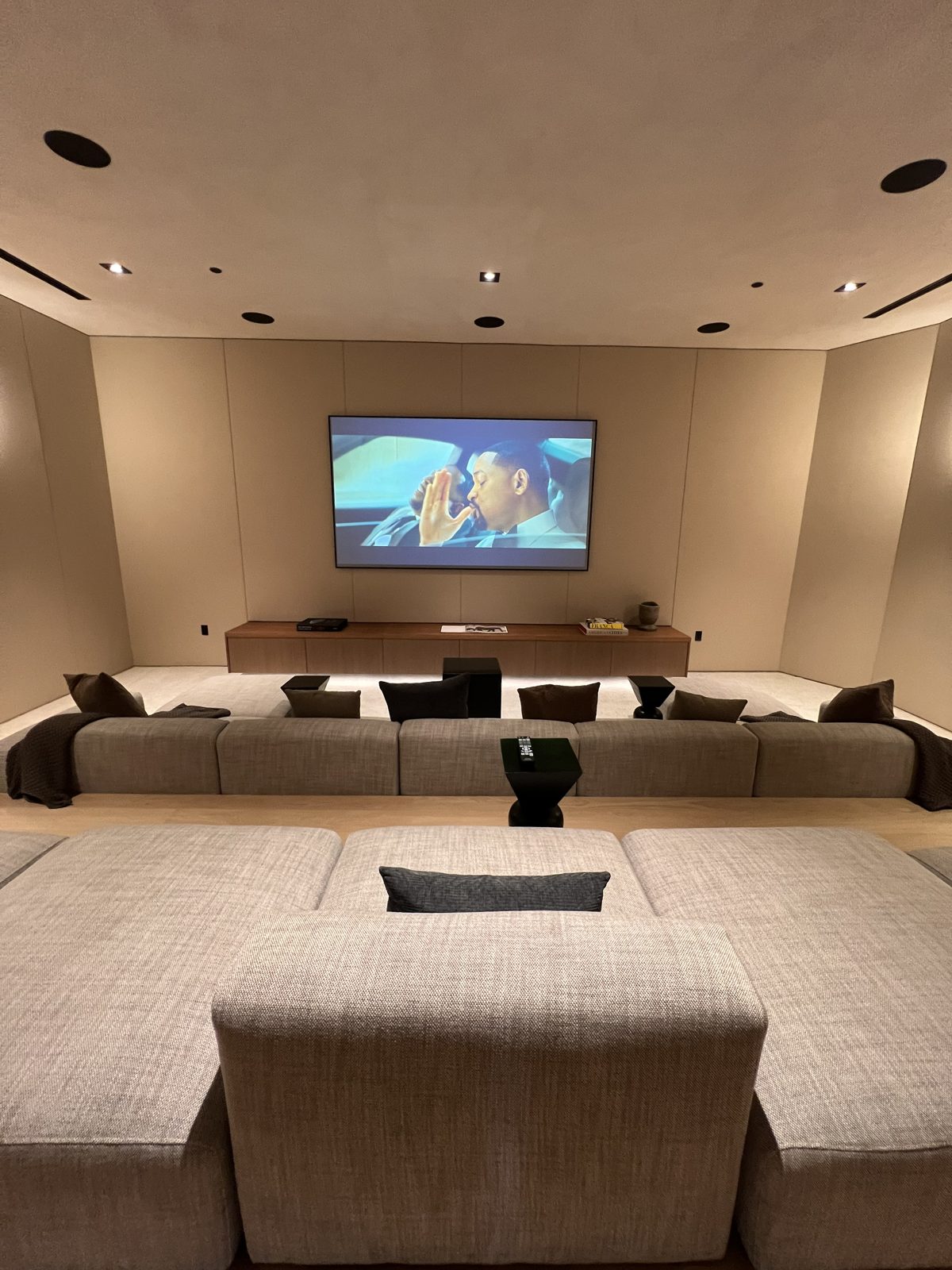 Media room with projector screen and lounge seating